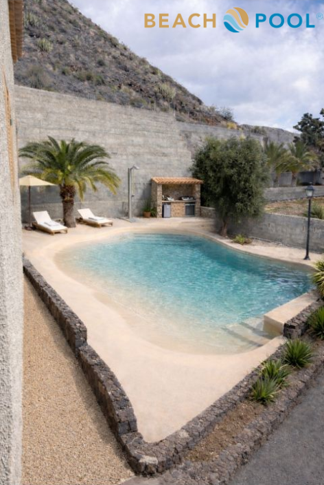 A small, secluded pool with two lounge chairs and a palm tree sits beside a stone wall, surrounded by landscaping; a BBQ area is visible in the background. The Luxury Pool Gallery logo appears at the top right.